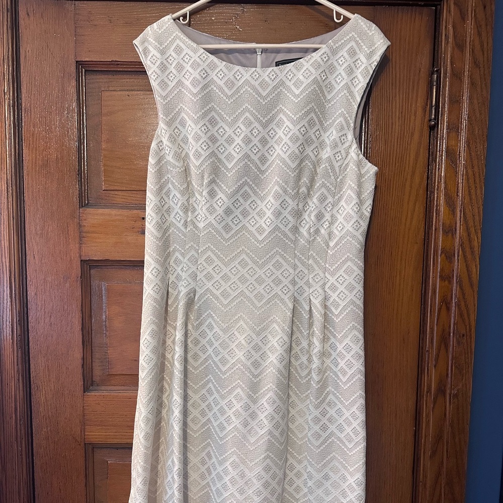 Knee length off white dress. Glitter throughout
